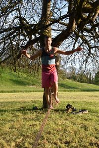 Full length of boy playing on grass