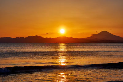 Scenic view of sea against sky during sunset