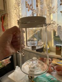 Midsection of person preparing food in glass