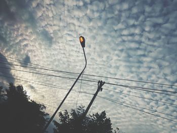 Low angle view of silhouette tree against sky