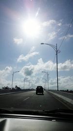 Cars on road against sky