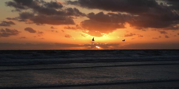 Scenic view of sea against sky during sunset