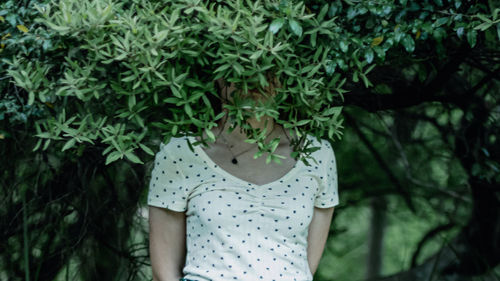 Woman standing by plants