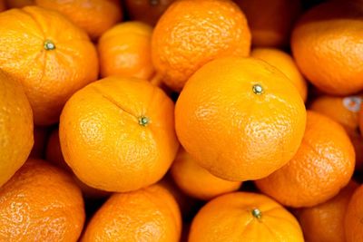 Full frame shot of oranges for sale at market stall