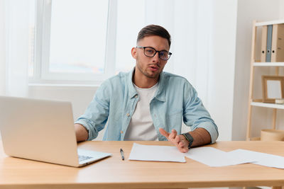 Portrait of businessman working at office