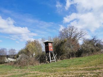 Built structure on field against sky