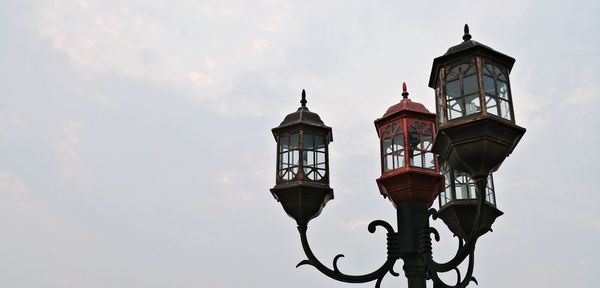 Low angle view of street light against sky