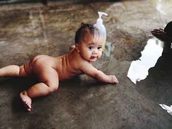 High angle view of baby boy taking bath