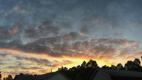 Low angle view of cloudy sky at sunset