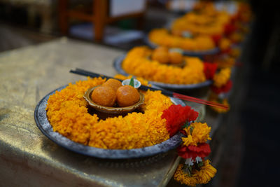 Ladus and garland in plate at temple