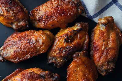 High angle view of roasted meat on barbecue