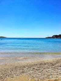 View of beach against blue sky