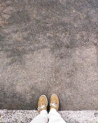 Low section of person standing on street