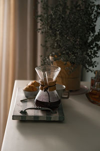 Close-up of coffee cup on table at home