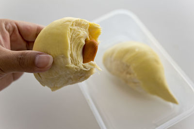 Close-up of hand holding ice cream