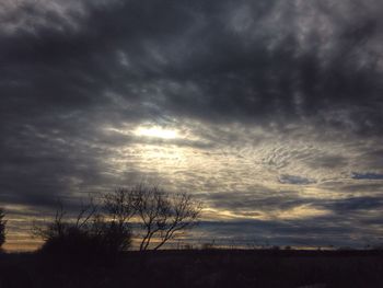 Scenic view of landscape against cloudy sky