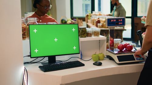 Midsection of woman using laptop on table