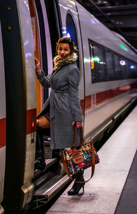 Portrait of woman entering train
