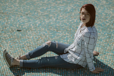 Portrait of woman sitting outdoors