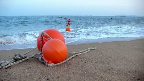 View of red boat on beach