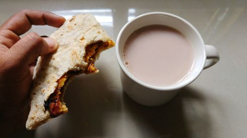 Close-up of cropped coffee cup