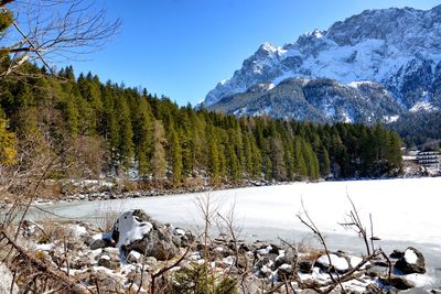 Scenic view of snowcapped mountains against clear sky