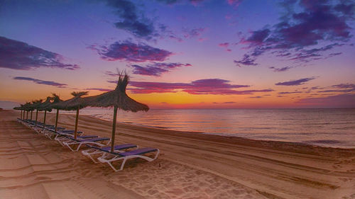 Scenic view of beach against sky during sunset
