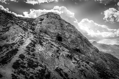 Low angle view of rock formation against sky