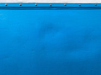 Close-up view of blue wall