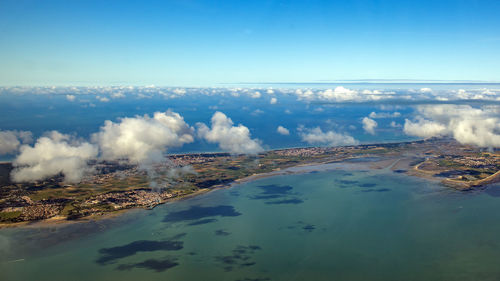 Scenic view of landscape against blue sky