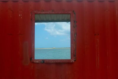 Close-up of sea seen through window