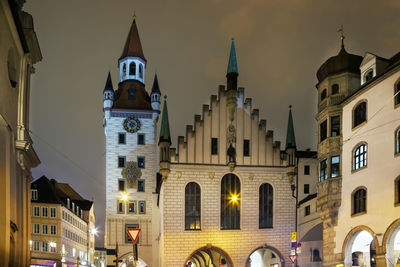 View of illuminated buildings in city at night