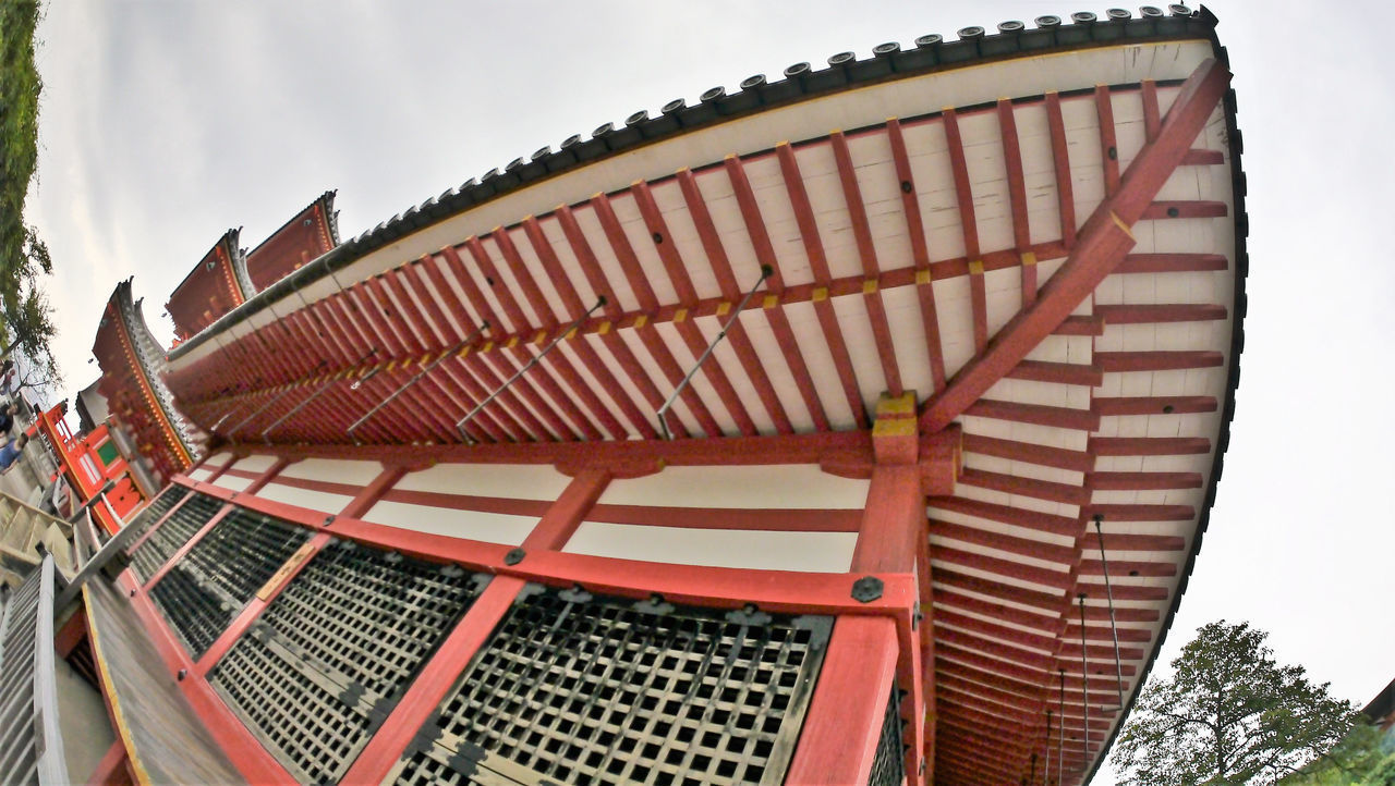 LOW ANGLE VIEW OF CAROUSEL AGAINST SKY