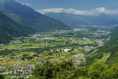 Aerial view of townscape by mountains