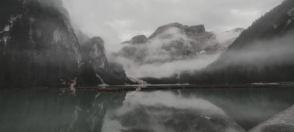 Panoramic view of lake of braies and mountains against sky