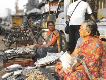 Women selling fish at market