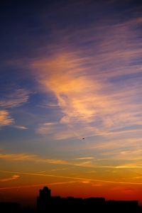 Low angle view of dramatic sky during sunset