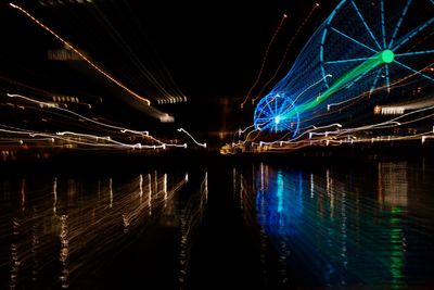 Reflection of illuminated lights on water at night