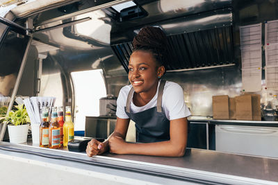 Portrait of smiling mid adult woman in restaurant