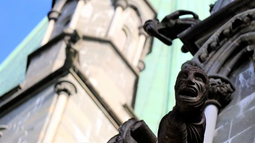 Low angle view of statue against blurred background