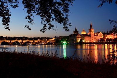 View of city at waterfront at night