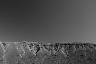 Scenic view of snowcapped landscape against clear sky