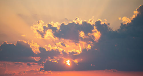 Low angle view of dramatic sky during sunset