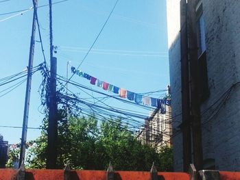 Low angle view of cables against sky