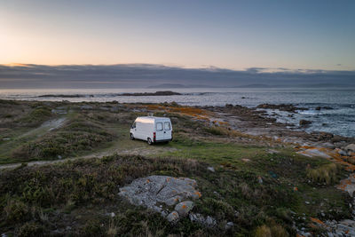 Camper van motorhome with solar panels drone aerial view living van life in galiza, spain