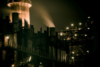 Illuminated buildings in city at night