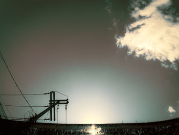 Low angle view of silhouette bridge against sky during sunset