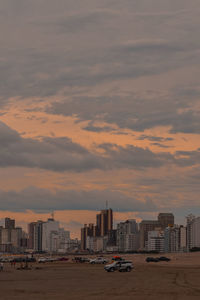 Cityscape against sky during sunset