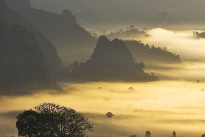 High angle view of silhouette mountains during sunset