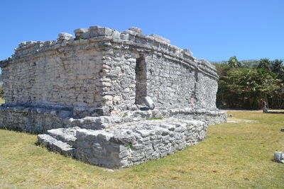 Low angle view of castle against clear blue sky